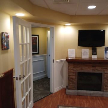 Dental clinic door and T.V. mount on wall